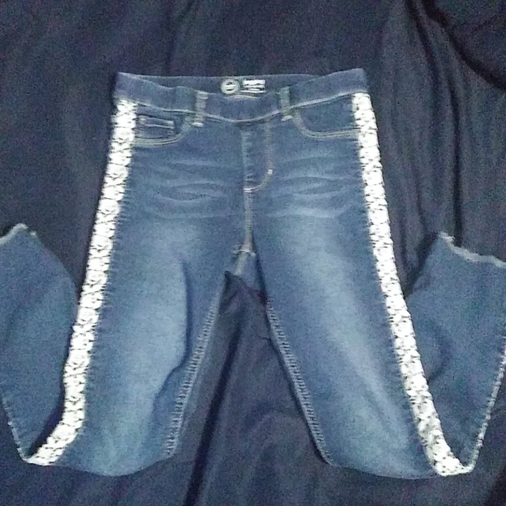 Girls jeggings with white lace detail.
